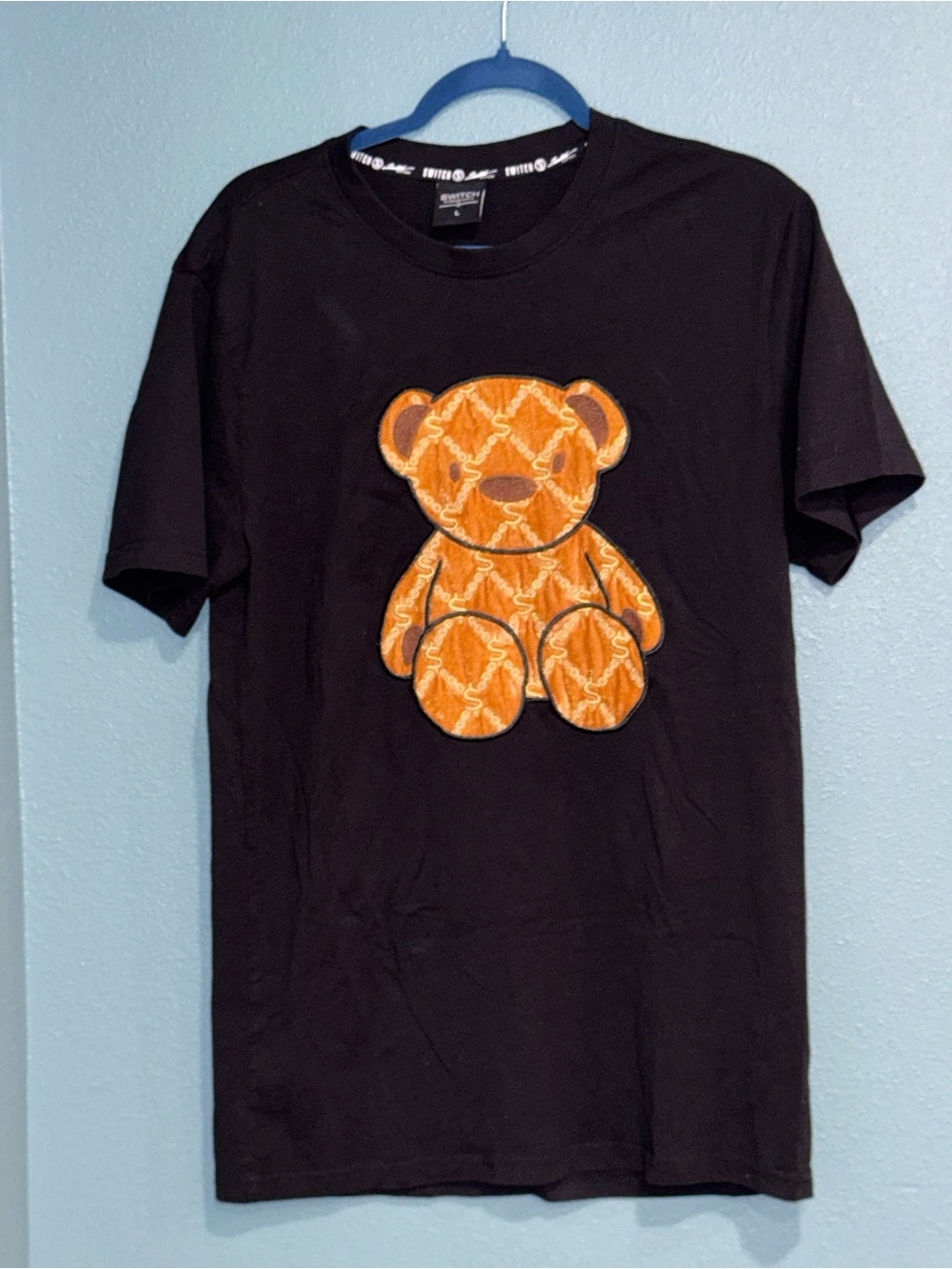 Black Short-Sleeve Tee with Orange Teddy Patch